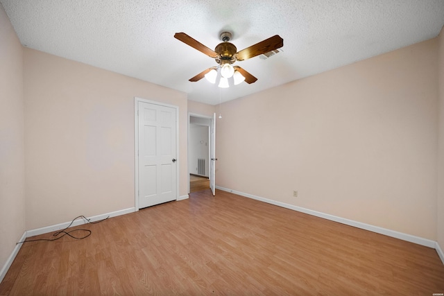 724 Weston Rd Unit Q-4, Hot Springs, AR 71913 - unfurnished bedroom featuring light wood-style floors, a ceiling fan, and a textured ceiling