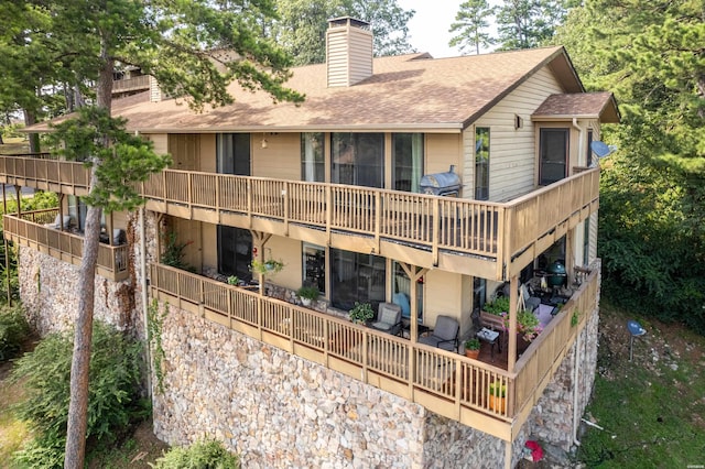 724 Weston Rd Unit Q-4, Hot Springs, AR 71913 - back of house featuring a chimney and roof with shingles