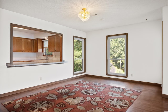 724 Weston Rd Unit Q-4, Hot Springs, AR 71913 - empty room featuring wood finished floors and a chandelier