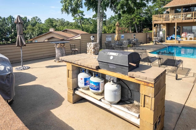724 Weston Rd Unit Q-4, Hot Springs, AR 71913 - view of patio with area for grilling, view of scattered trees, and outdoor dining area