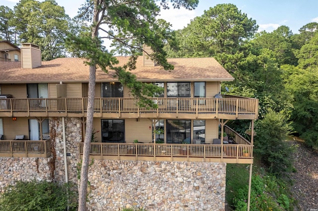 724 Weston Rd Unit Q-4, Hot Springs, AR 71913 - back of property with a chimney, a shingled roof, and stone siding