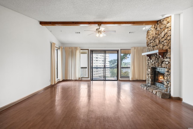 724 Weston Rd Unit Q-4, Hot Springs, AR 71913 - unfurnished living room with wood finished floors, a stone fireplace, a ceiling fan, and a textured ceiling