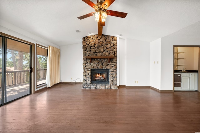 724 Weston Rd Unit Q-4, Hot Springs, AR 71913 - unfurnished living room featuring dark wood-style flooring, ceiling fan, and a fireplace