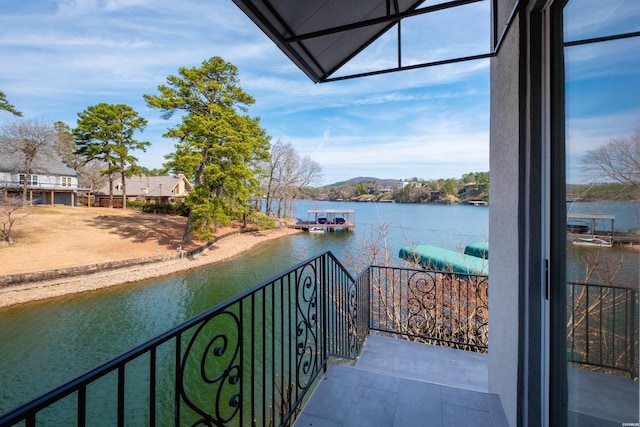 balcony featuring a water view