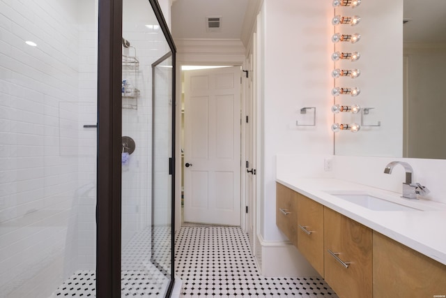 bathroom with visible vents, a shower stall, ornamental molding, and vanity