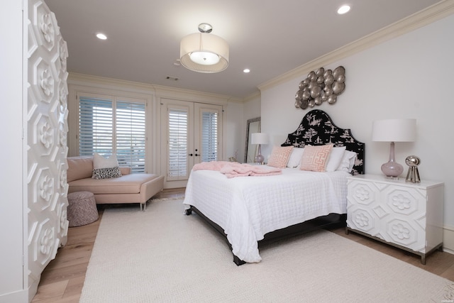 bedroom featuring wood finished floors, french doors, ornamental molding, and access to exterior