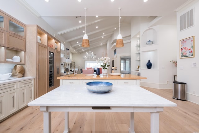 kitchen featuring recessed lighting, visible vents, open shelves, and a large island