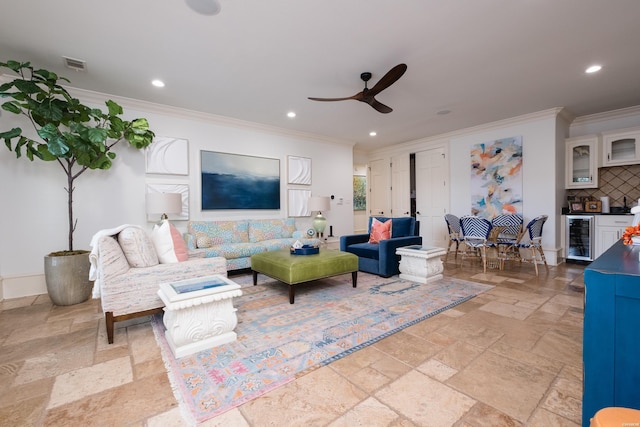 living room featuring recessed lighting, stone tile flooring, ceiling fan, visible vents, and beverage cooler