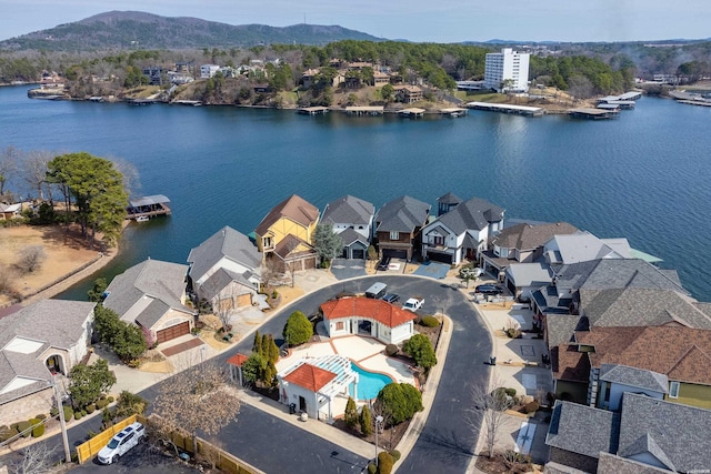 drone / aerial view with a residential view and a water and mountain view