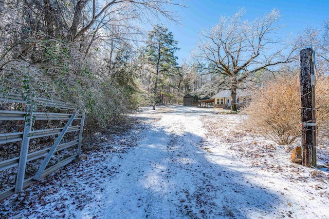 view of street featuring driveway and a gated entry