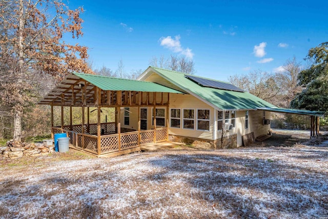 exterior space featuring metal roof