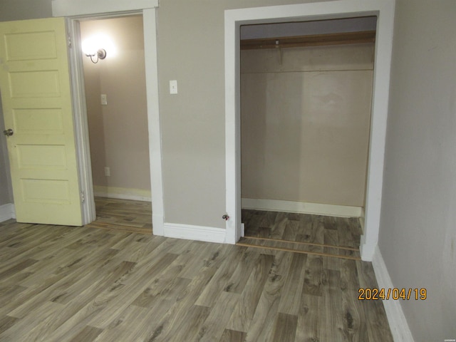 310 Hawthorne St Unit 1, 2, 3, 4, 5, Hot Springs, AR 71901 - unfurnished bedroom with a closet, wood finished floors, and baseboards