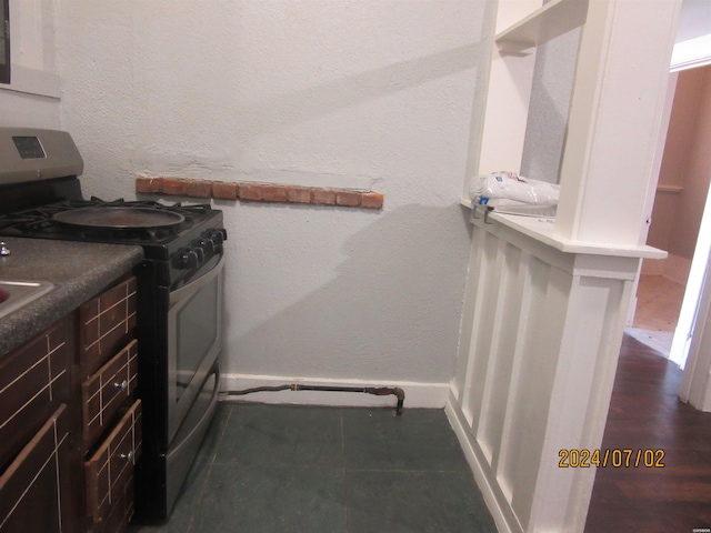 310 Hawthorne St Unit 1, 2, 3, 4, 5, Hot Springs, AR 71901 - interior space with baseboards, a textured wall, gas stove, and white cabinets