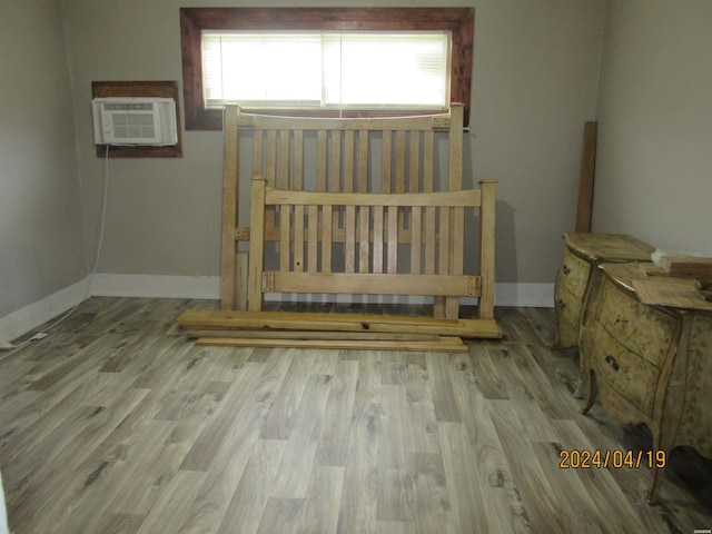 310 Hawthorne St Unit 1, 2, 3, 4, 5, Hot Springs, AR 71901 - empty room featuring light wood-style flooring, baseboards, and a wall mounted air conditioner