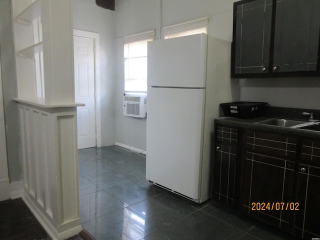 310 Hawthorne St Unit 1, 2, 3, 4, 5, Hot Springs, AR 71901 - kitchen with dark tile patterned flooring, a sink, freestanding refrigerator, and dark cabinetry