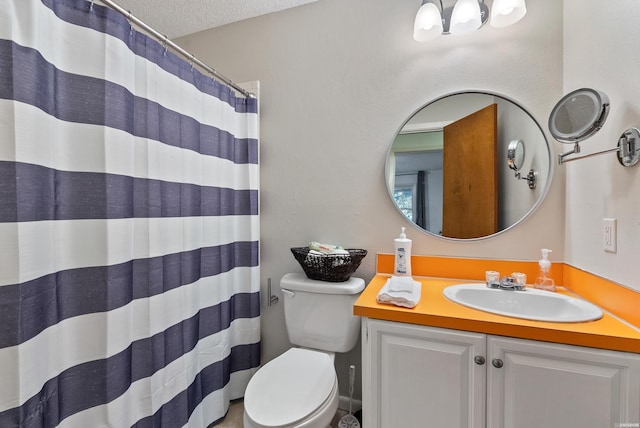 bathroom with toilet, a shower with curtain, a textured ceiling, and vanity