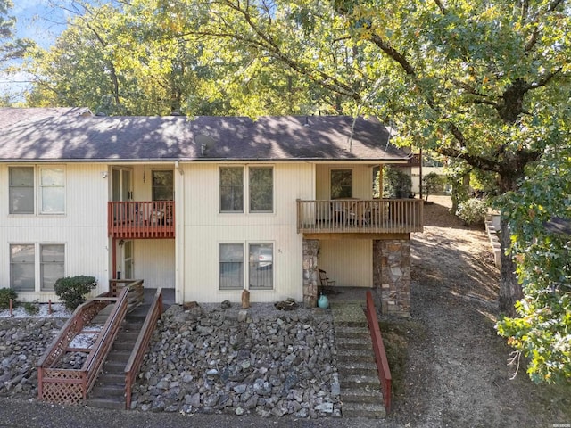 back of house with a balcony and stairs