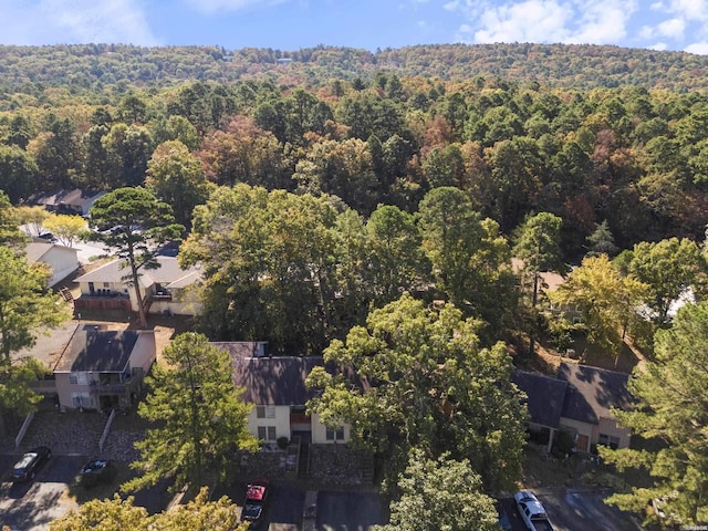 birds eye view of property with a residential view and a wooded view