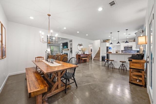 109 Spencer Chase Ct, Hot Springs, AR 71901 - dining area featuring concrete floors, recessed lighting, stairway, and a chandelier