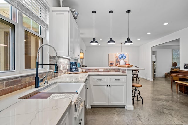 109 Spencer Chase Ct, Hot Springs, AR 71901 - kitchen with concrete floors, tasteful backsplash, a peninsula, recessed lighting, and white cabinets
