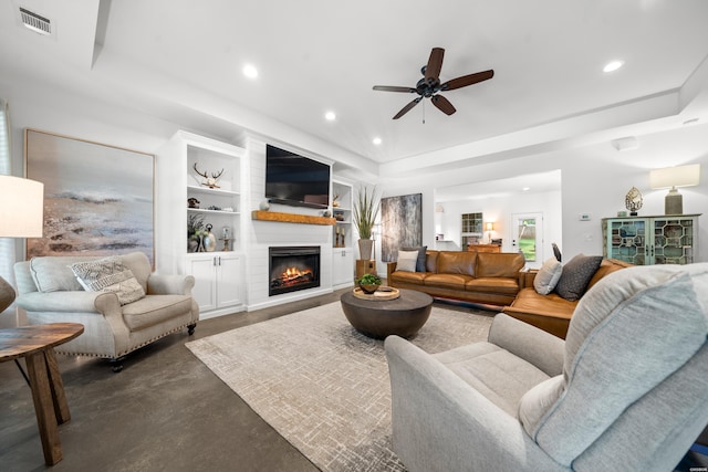 109 Spencer Chase Ct, Hot Springs, AR 71901 - living room with finished concrete flooring, a raised ceiling, a ceiling fan, recessed lighting, and a fireplace