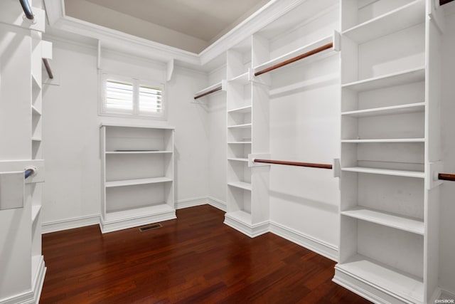 walk in closet with visible vents and wood finished floors