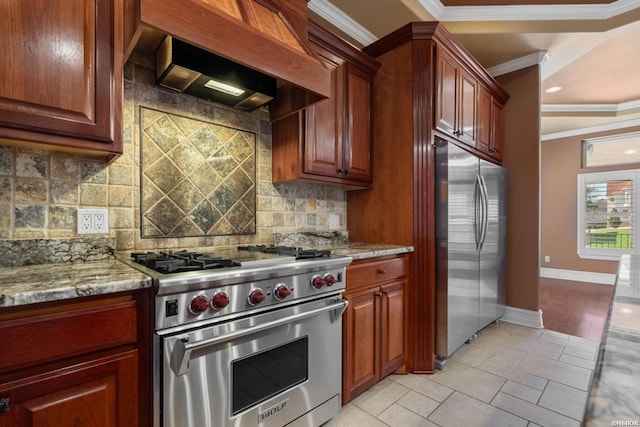 kitchen featuring light stone counters, baseboards, custom exhaust hood, stainless steel appliances, and crown molding