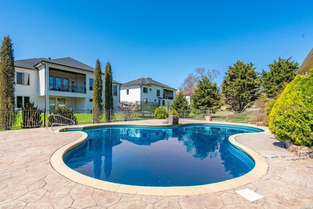 view of pool with a fenced in pool, a patio, and fence