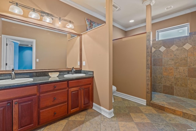 full bath featuring double vanity, ornamental molding, a walk in shower, and a sink