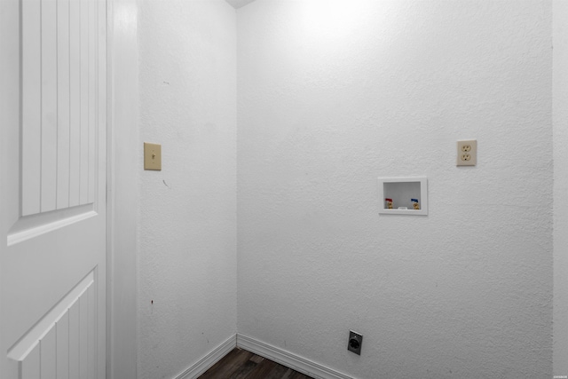 washroom with hookup for a washing machine, hookup for an electric dryer, laundry area, dark wood-style flooring, and baseboards