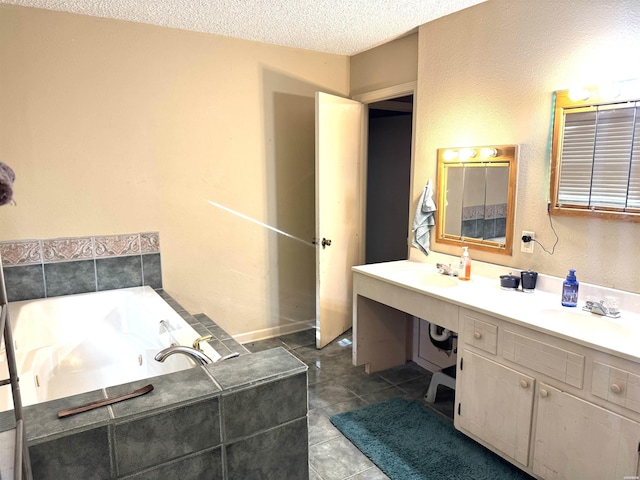 122 Mesa Trl, Hot Springs, AR 71913 - full bathroom featuring double vanity, a garden tub, a textured ceiling, and tile patterned flooring