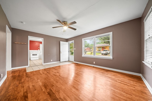 204 First, Hot Springs, AR 71913 - spare room with light wood-style flooring, ceiling fan, baseboards, and a smoke detector