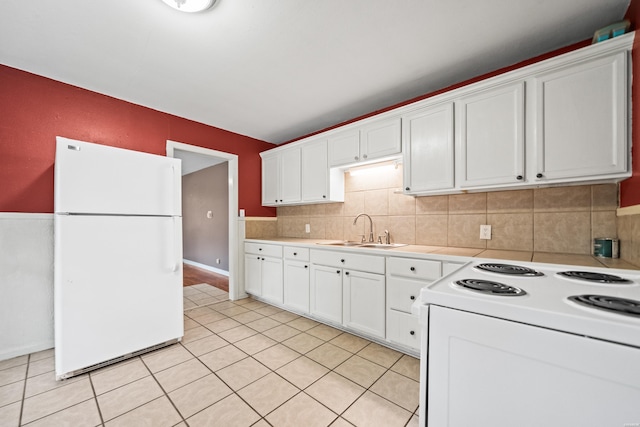 204 First, Hot Springs, AR 71913 - kitchen featuring white appliances, a sink, light countertops, white cabinets, and light tile patterned floors