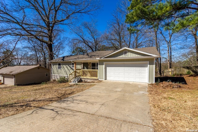 ranch-style home with a garage, concrete driveway, and roof with shingles