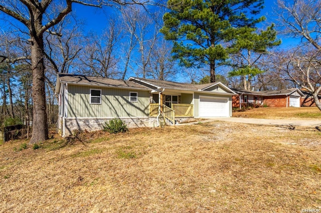 ranch-style home featuring driveway and an attached garage