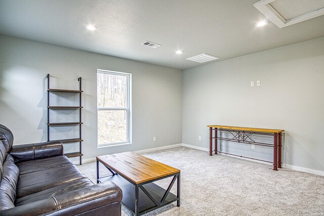 living room with light carpet, baseboards, visible vents, and recessed lighting