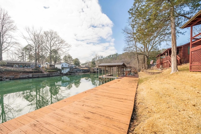 view of dock featuring a water view and stairs