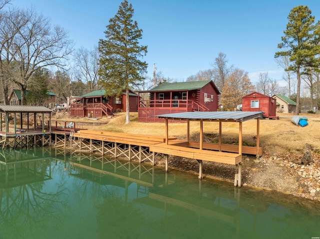 view of dock with a deck with water view