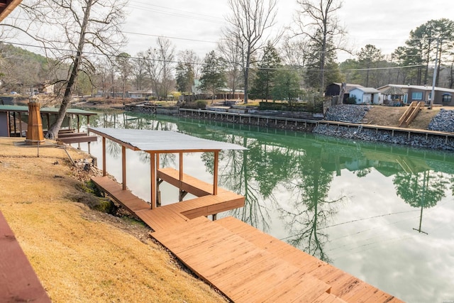 dock area with a water view