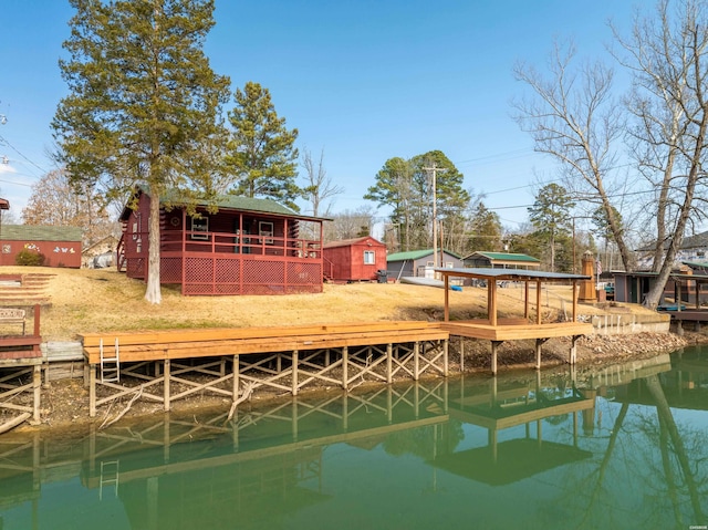 view of dock featuring a deck with water view