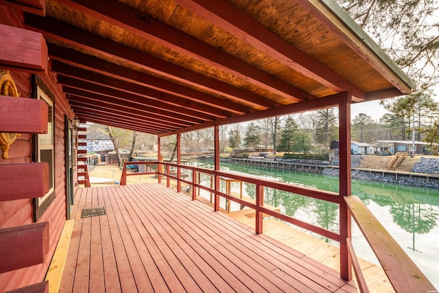 wooden terrace with a water view