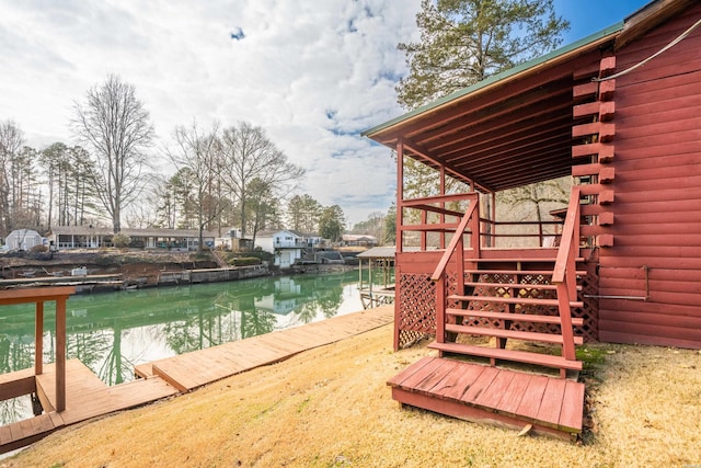 dock area featuring a water view and stairway