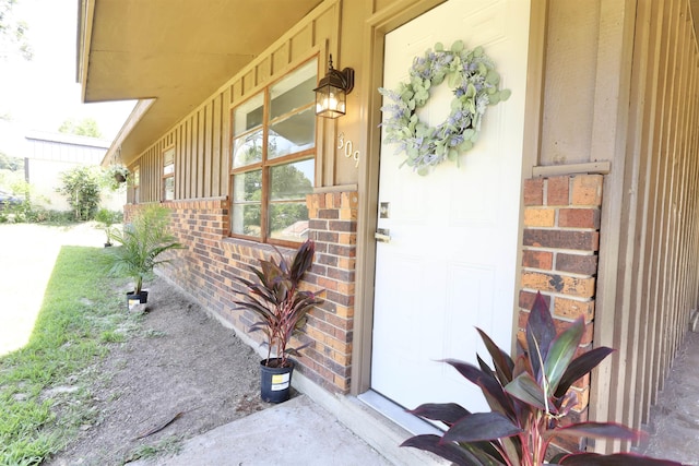 entrance to property with brick siding