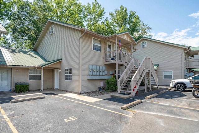 183 River Mill Ct Unit B-2, Hot Springs, AR 71913 - view of building exterior with uncovered parking and stairway