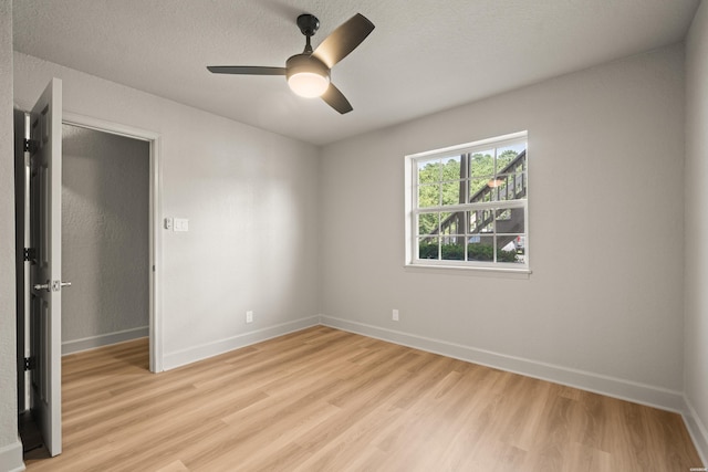 183 River Mill Ct Unit B-2, Hot Springs, AR 71913 - unfurnished room with light wood-style floors, ceiling fan, and a textured ceiling