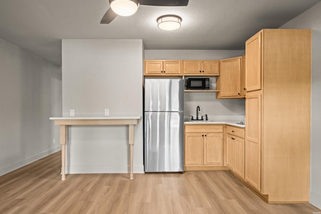 183 River Mill Ct Unit B-2, Hot Springs, AR 71913 - kitchen featuring freestanding refrigerator, light wood finished floors, and light brown cabinets