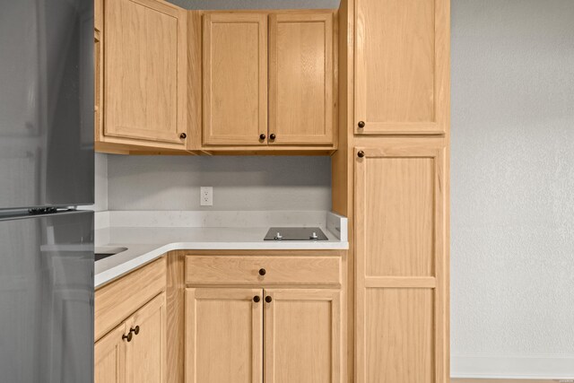 183 River Mill Ct Unit B-2, Hot Springs, AR 71913 - kitchen with light brown cabinetry, freestanding refrigerator, and light countertops