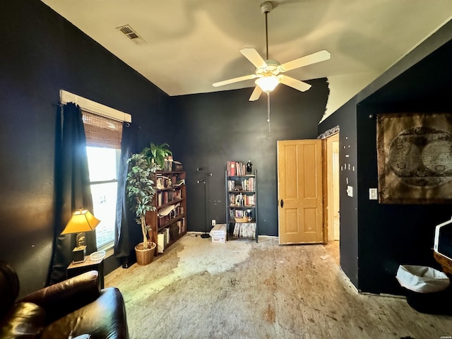 sitting room featuring visible vents, vaulted ceiling, and ceiling fan