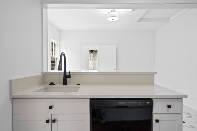 kitchen featuring a sink, black dishwasher, white cabinetry, and marble finish floor