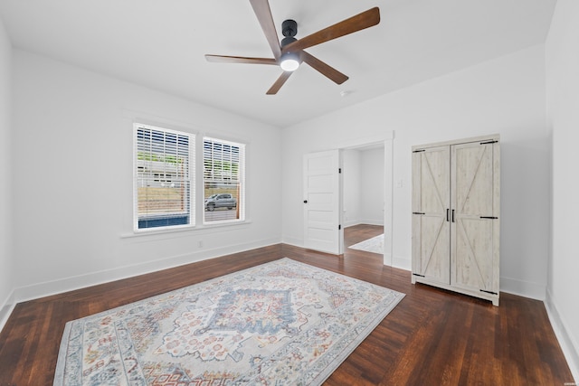 bedroom with baseboards, a ceiling fan, and wood finished floors